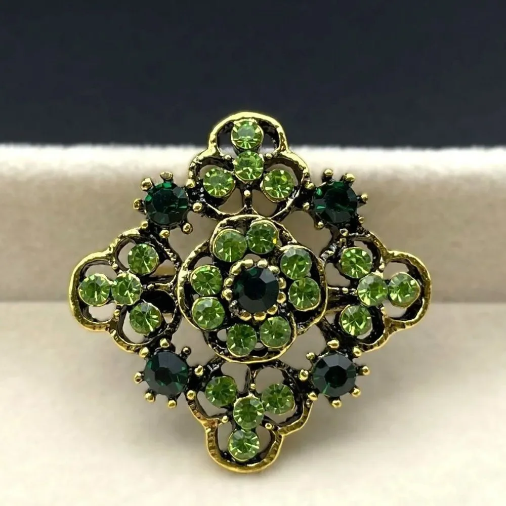 Yellow Gold with Emerald and Peridot Green Crystal Ornate Pin Back Brooch